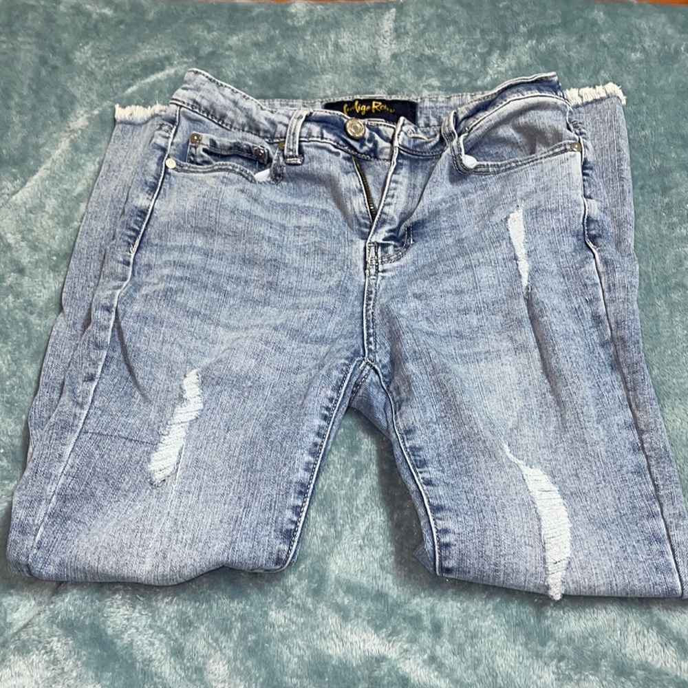 Distressed blue skinny jeans